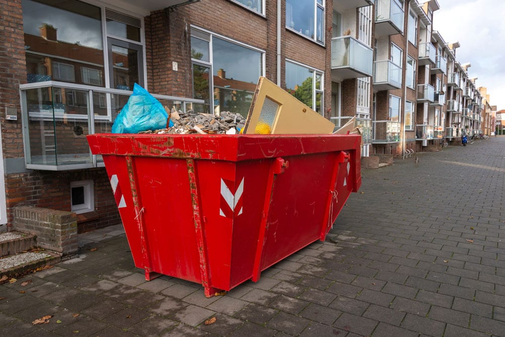 skip bin overfilled household rubbish