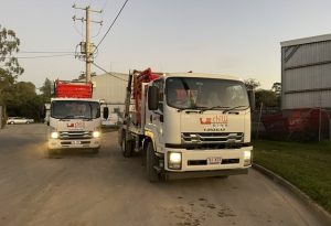 Front View Of Two Trucks — Cheap Skip Bin Hire in Sunshine Coast, QLD